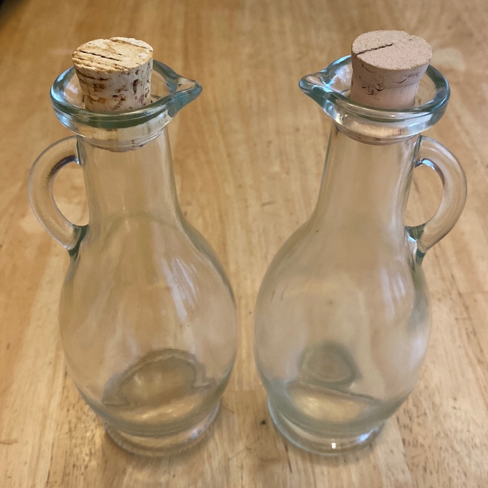 Oil and vinegar cruet set. Clear. About 7 inches.